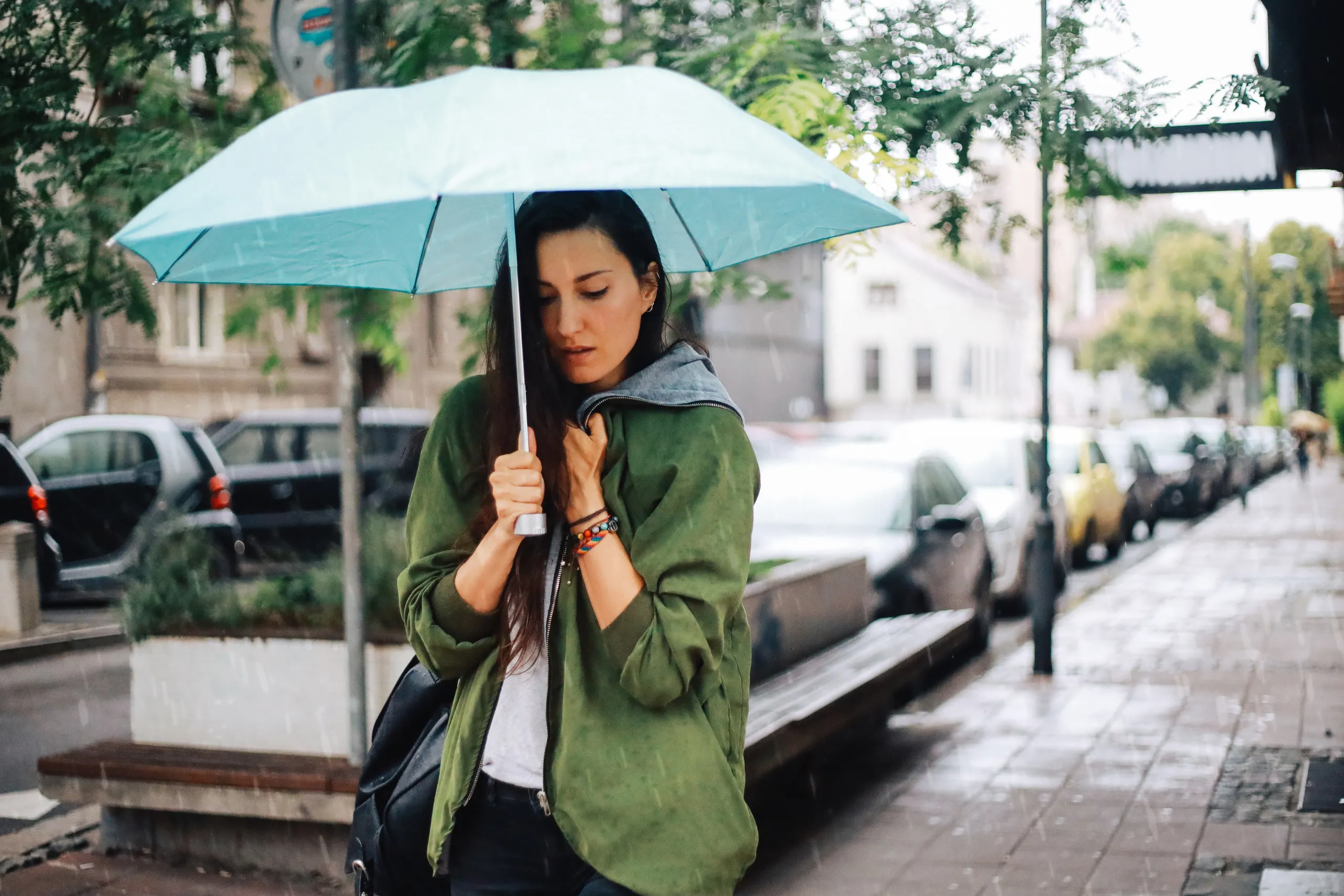 Woman getting caught in the rain
